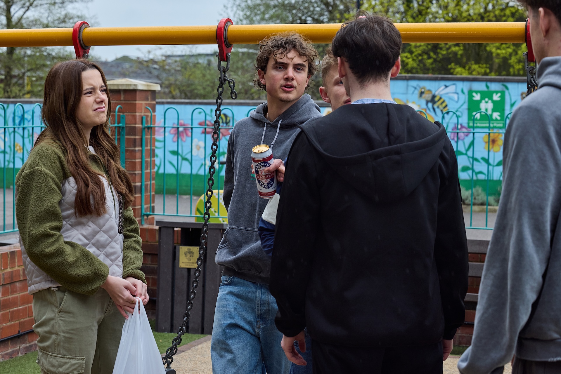Betsy, Brody, Dylan and other lads at the precinct in Coronation Street