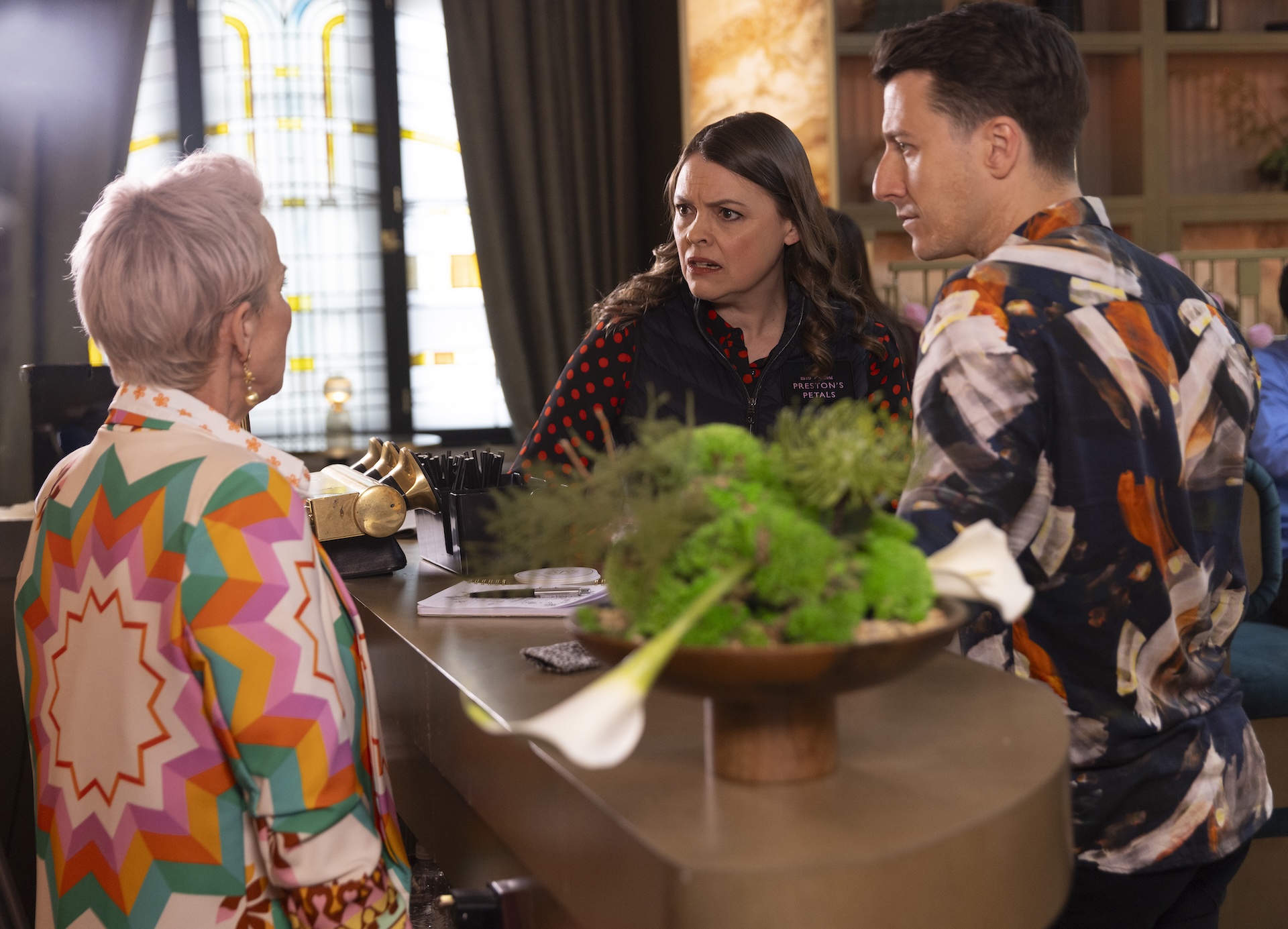 Coronation Street's Tracy, Ryan and Debbie talking at the hotel